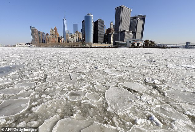 The frigid Arctic air could send temperatures plummeting to well below freezing. The image above shows Lower Manhattan from the Staten Island Ferry as New York Harbor is filled with large chunks of ice in February 2015