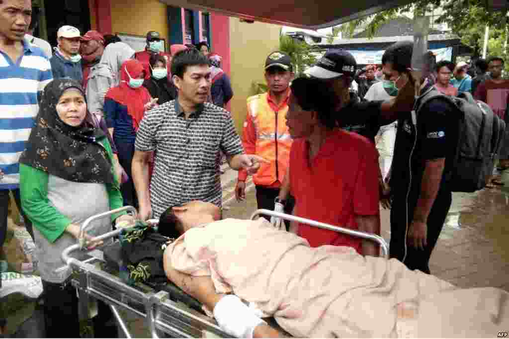 A survivor receives medical treatment at a hospital in Carita, Dec. 23, 2018, after the area was hit by a tsunami Saturday following an eruption of the Anak Krakatoa volcano.