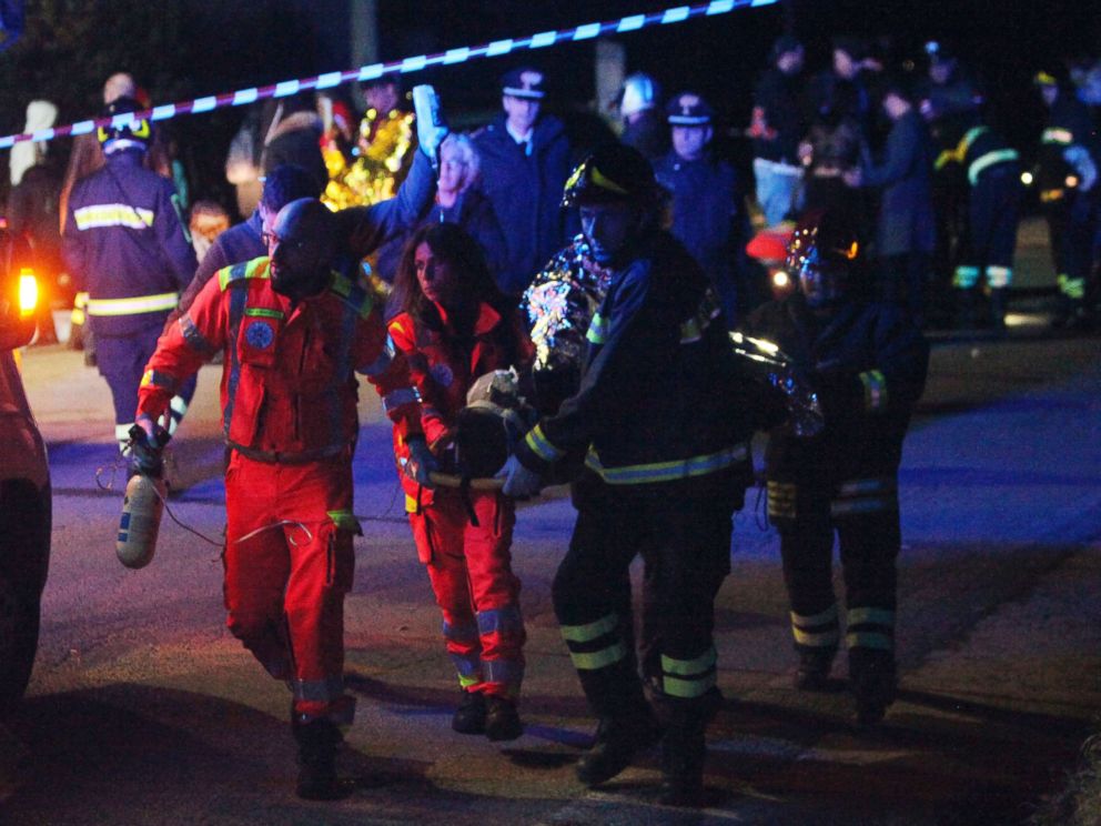 PHOTO: Rescuers assist injured people outside the disco Lanterna Azzurra in Corinaldo, Italy, Dec. 8, 2018.