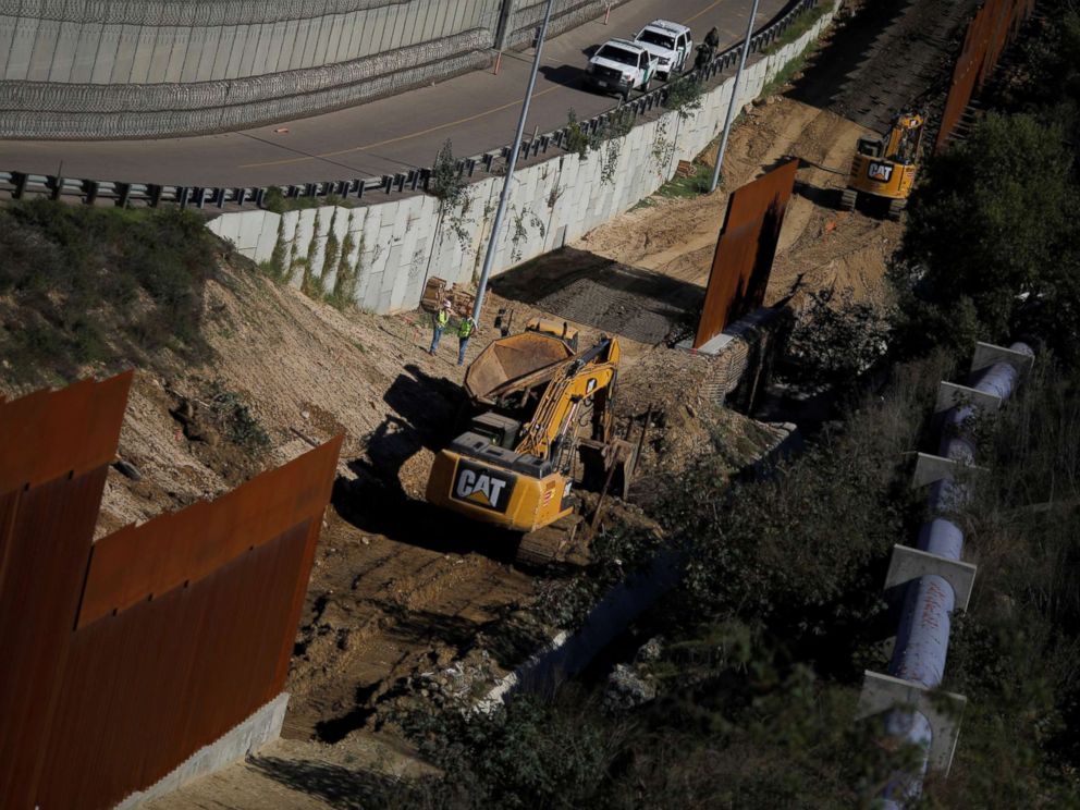 PHOTO: Workers are seen next a construction site of the border fence between United States and Mexico, seen from Tijuana, Mexico, Dec. 19, 2018.