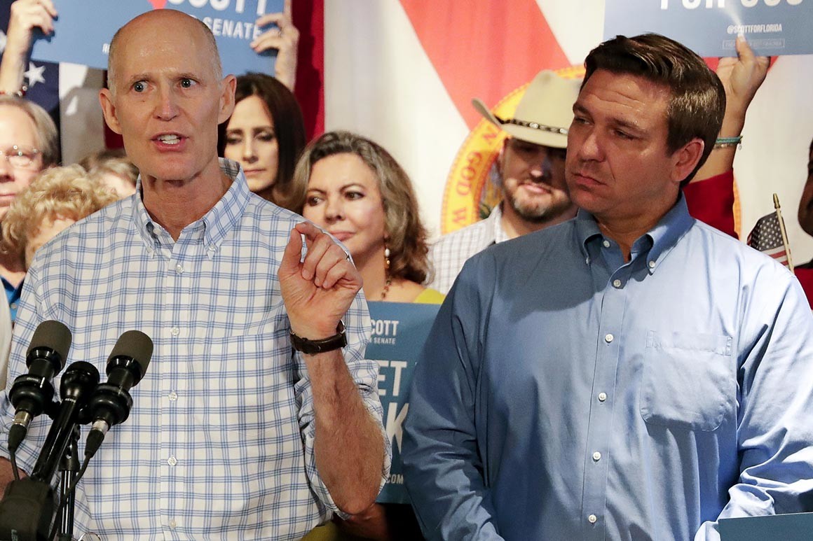 Rick Scott and Ron DeSantis at a campaign rally before the midterms