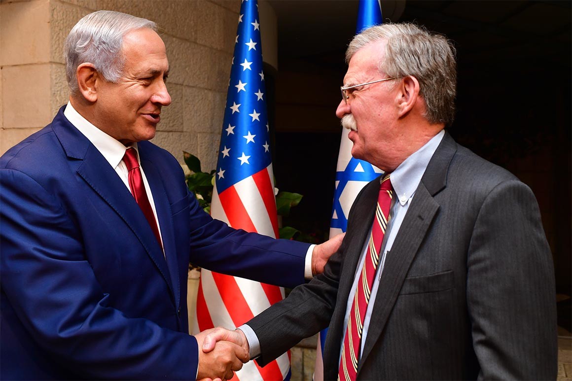 Israeli Prime Minister Benjamin Netanyahu shakes hands with national security adviser John Bolton.